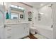 Bathroom featuring a white vanity with ample storage, a glass-enclosed shower, and modern fixtures at 11 1St E St, Nokomis, FL 34275