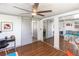 Spacious bedroom featuring a built-in closet with mirrored sliding doors, modern desk and lots of natural light at 11 1St E St, Nokomis, FL 34275