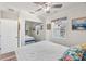 Bedroom with cozy bed, stylish linens, and a mirrored closet for added space at 11 1St E St, Nokomis, FL 34275