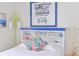 Cozy bedroom with built-in shelving, modern lighting, and a decorative headboard at 11 1St E St, Nokomis, FL 34275