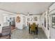 Open-concept dining room with a modern ceiling fan and easy access to the kitchen at 11 1St E St, Nokomis, FL 34275
