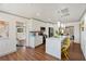 Bright, open kitchen featuring a large marble island with seating and modern appliances at 11 1St E St, Nokomis, FL 34275