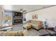 Cozy living room features large windows, fireplace, ceiling fan, and comfortable seating at 11 1St E St, Nokomis, FL 34275