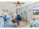 Comfortable living room with bright decor, plush armchairs, and view to the front yard at 11 1St E St, Nokomis, FL 34275