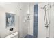 Modern shower with glass door and beautiful tile design at 11 1St E St, Nokomis, FL 34275