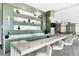 Modern bar area featuring sleek countertops, stylish lighting, and ample seating at 1155 N Gulfstream Ave # 508, Sarasota, FL 34236
