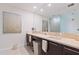 Elegant bathroom featuring double sinks, marble countertops, and modern fixtures at 1155 N Gulfstream Ave # 508, Sarasota, FL 34236