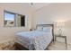 Bright bedroom features a large window, ceiling fan, and stylish furnishings at 1155 N Gulfstream Ave # 508, Sarasota, FL 34236