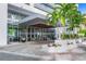Elegant building entrance with lush landscaping, offering a welcoming arrival experience at 1155 N Gulfstream Ave # 508, Sarasota, FL 34236