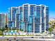 Modern high-rise building with striking architecture and sleek glass balconies at 1155 N Gulfstream Ave # 508, Sarasota, FL 34236