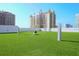 Rooftop dog park with lush artificial turf, providing a safe and enjoyable space for pets at 1155 N Gulfstream Ave # 508, Sarasota, FL 34236