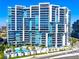 Stunning high-rise condo building featuring balconies and a luxurious pool at 1155 N Gulfstream Ave # 508, Sarasota, FL 34236