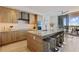 Bright kitchen featuring stainless steel appliances, granite countertops, and a breakfast bar at 1155 N Gulfstream Ave # 508, Sarasota, FL 34236