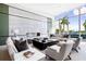 Bright living room with floor-to-ceiling windows and comfortable, upscale seating at 1155 N Gulfstream Ave # 508, Sarasota, FL 34236