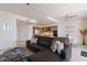 Inviting living room with a cozy sectional sofa, modern furnishings, and an open-concept kitchen at 1155 N Gulfstream Ave # 508, Sarasota, FL 34236