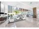 Bright lobby features floor-to-ceiling windows and modern seating areas at 1155 N Gulfstream Ave # 508, Sarasota, FL 34236