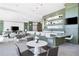 Bright community lounge with a bar area, tables, and seating at 1155 N Gulfstream Ave # 508, Sarasota, FL 34236