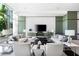 Bright lounge featuring modern furniture and a textured accent wall at 1155 N Gulfstream Ave # 508, Sarasota, FL 34236