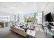 Bright lounge area with large windows and comfortable seating arrangement at 1155 N Gulfstream Ave # 508, Sarasota, FL 34236