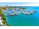 Stunning aerial view of the marina filled with yachts and boats on a sunny day at 1155 N Gulfstream Ave # 508, Sarasota, FL 34236