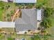 Aerial view of home with manicured landscaping, patio and driveway at 125 Golf Club Ln, Venice, FL 34293