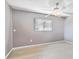 Neutral bedroom featuring wood-look flooring, a ceiling fan with lighting, and a window with blinds at 125 Golf Club Ln, Venice, FL 34293