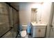 Modern bathroom featuring a glass shower, toilet, and vanity with a mirror at 13339 Flaherty Ave, Port Charlotte, FL 33981
