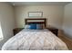 Comfortable bedroom featuring a plush queen bed with stylish bedding and wooden nightstands at 13339 Flaherty Ave, Port Charlotte, FL 33981