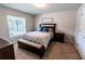 Relaxing bedroom with a queen-sized bed, wooden furniture, and serene decor at 13339 Flaherty Ave, Port Charlotte, FL 33981
