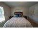 Bright bedroom featuring a plush queen bed with stylish bedding and wooden nightstands at 13339 Flaherty Ave, Port Charlotte, FL 33981