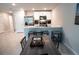 Bright kitchen and dining area with stainless steel appliances and seating at the breakfast bar at 13339 Flaherty Ave, Port Charlotte, FL 33981