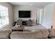 Inviting living room featuring modern furnishings, a large TV, and a cozy seating area at 13339 Flaherty Ave, Port Charlotte, FL 33981