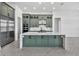 Contemporary kitchen showcasing a large island with quartz countertops and green cabinetry, perfect for culinary enthusiasts at 17916 Palmiste Dr, Bradenton, FL 34202