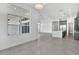 Open-concept living space with hardwood floors, recessed lighting, and modern kitchen in view at 17916 Palmiste Dr, Bradenton, FL 34202