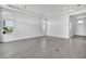 Spacious living room featuring herringbone floors, recessed lighting, and ample natural light at 17916 Palmiste Dr, Bradenton, FL 34202
