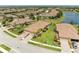 Breathtaking aerial view showcasing property with lush greenery, beautiful landscaping, prime location, and inviting curb appeal at 19889 Benissimo Dr, Venice, FL 34293