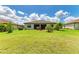 Spacious backyard with manicured lawn, offering ample space for outdoor activities and relaxation at 19889 Benissimo Dr, Venice, FL 34293