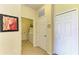 Hallway with closet doors leading to the laundry room at 19889 Benissimo Dr, Venice, FL 34293