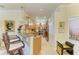 Charming kitchen bar area with granite counters, stainless appliances, and pendant lighting at 19889 Benissimo Dr, Venice, FL 34293