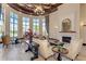 Elegant lobby with a cozy fireplace, comfortable seating, and plenty of natural light at 19889 Benissimo Dr, Venice, FL 34293