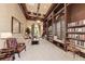 Cozy community library with comfortable seating, bookshelves, and natural light at 19889 Benissimo Dr, Venice, FL 34293