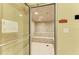 Well-maintained steam room with tile walls and floor, and built-in benches at 19889 Benissimo Dr, Venice, FL 34293