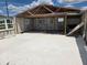 Unfinished garage with exposed beams, concrete floor and block walls provides an opportunity to add your personal touch at 2061 Georgia Ave, Englewood, FL 34224