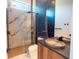 Modern bathroom featuring an elegant vanity, a unique sink, and a sleek glass shower at 2375 Floyd St, Sarasota, FL 34239