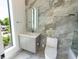Charming bathroom features modern sink and toilet and a bright window view at 2375 Floyd St, Sarasota, FL 34239