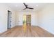 Comfortable bedroom with ample space, modern lighting and access to the staircase at 2375 Floyd St, Sarasota, FL 34239