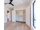 Bedroom with light floors featuring a closet with built in storage and shelving at 2375 Floyd St, Sarasota, FL 34239