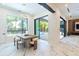 Dining area features a stylish table set and a seamless transition to outdoor pool area at 2375 Floyd St, Sarasota, FL 34239