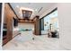Gourmet kitchen with marble flooring, wooden cabinetry, island seating and modern appliances at 2375 Floyd St, Sarasota, FL 34239