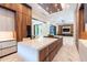 Spacious kitchen featuring a marble island, sleek appliances, and an open layout connecting to the living area at 2375 Floyd St, Sarasota, FL 34239